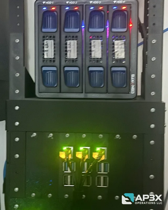 Black 3D-printed equipment rack holding a four-bay drive enclosure, three networked single-board computers and a network switch.
